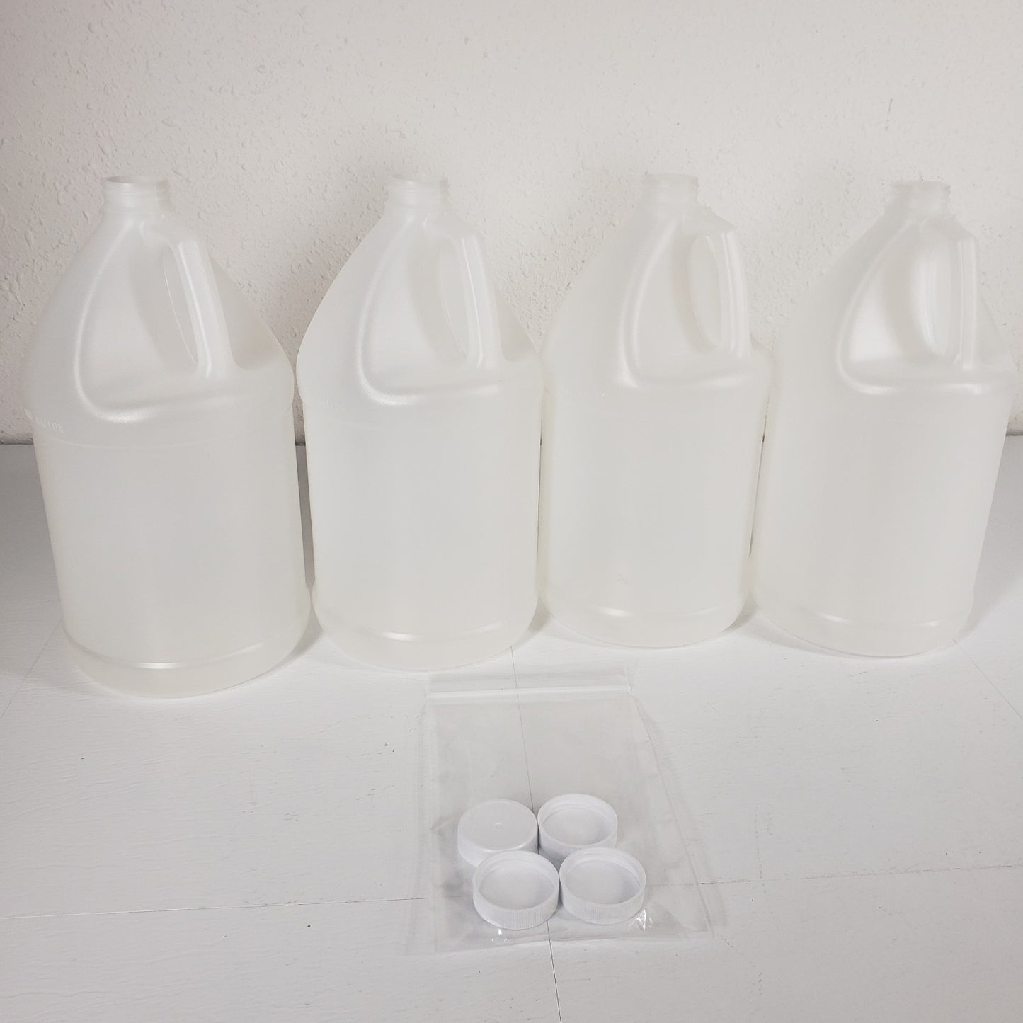 Plastipak Packaging Inc 4-1 Gallon Plastic Bottles With Caps Clear HDPE