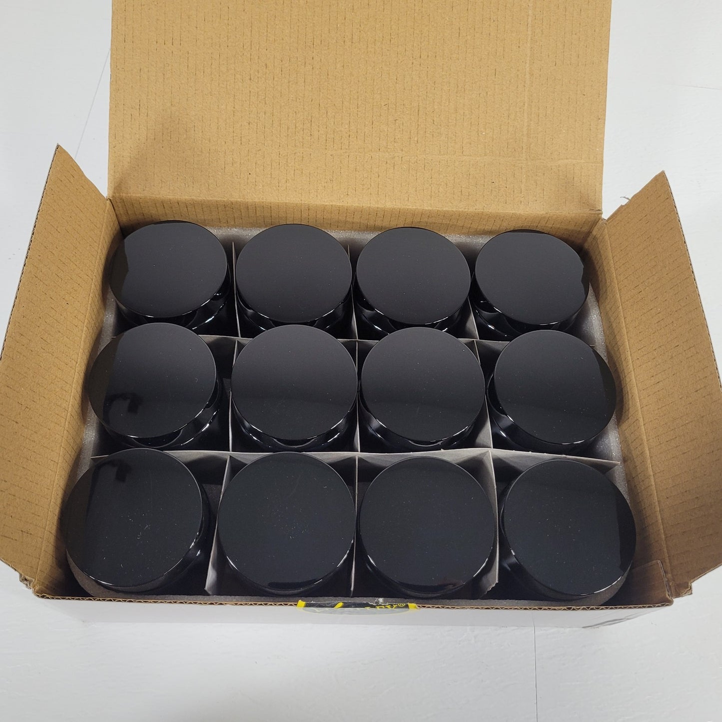Vivaplex Amber 4 Oz Round Glass Jars with Inner Liners and Black Lids - 12 Pack