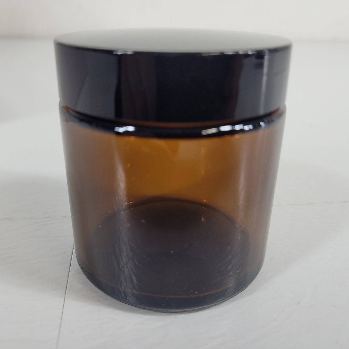 Vivaplex Amber 4 Oz Round Glass Jars with Inner Liners and Black Lids - 12 Pack