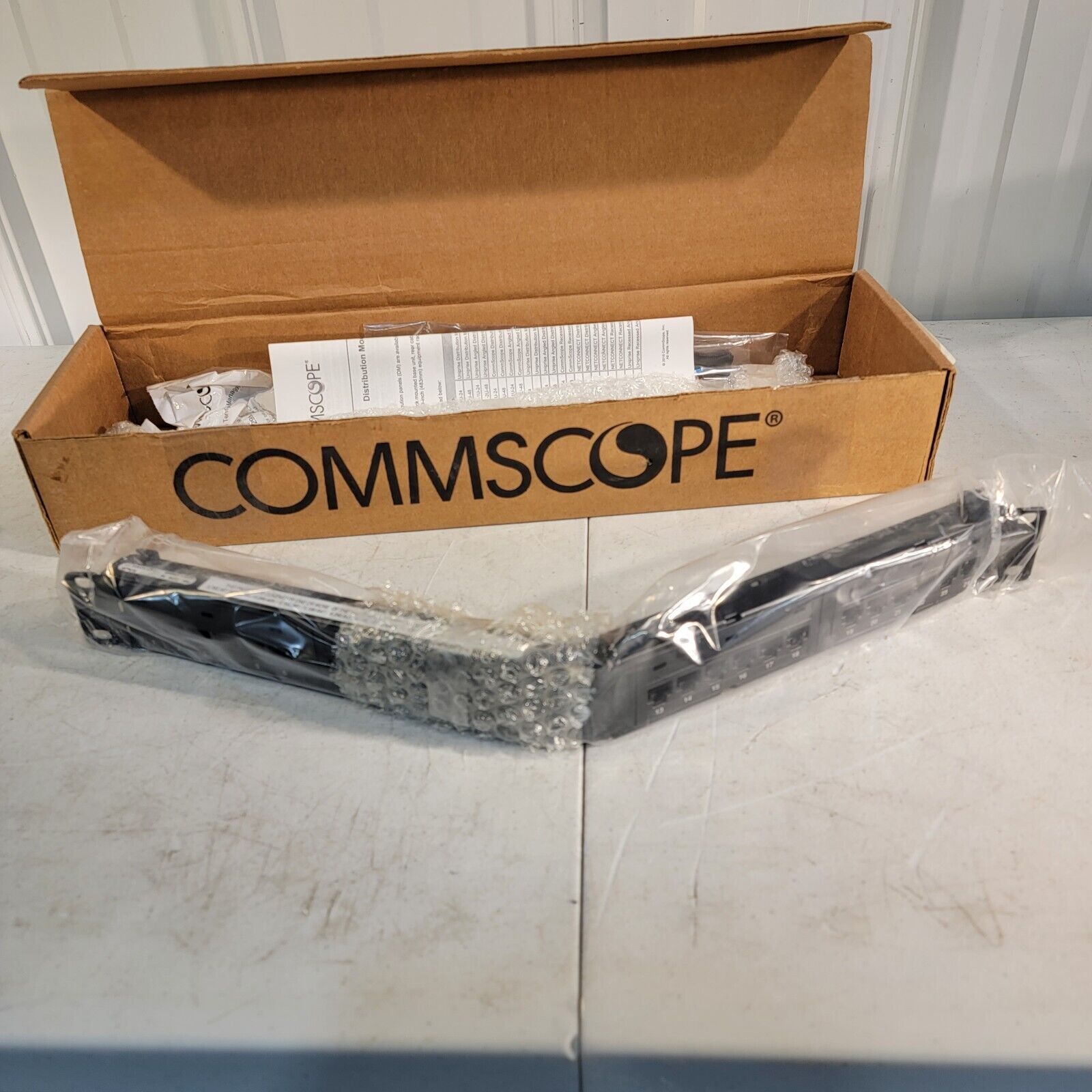 CommScope 760162834 Angled Distribution Module Panel Cat 6A UTP 2U 48