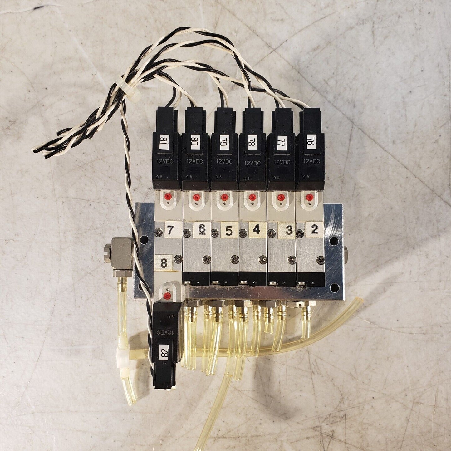 Koganei 040M6A-64W Manifold Block with (7) A040-4E1-37W Solenoid Valves 0.3MPa