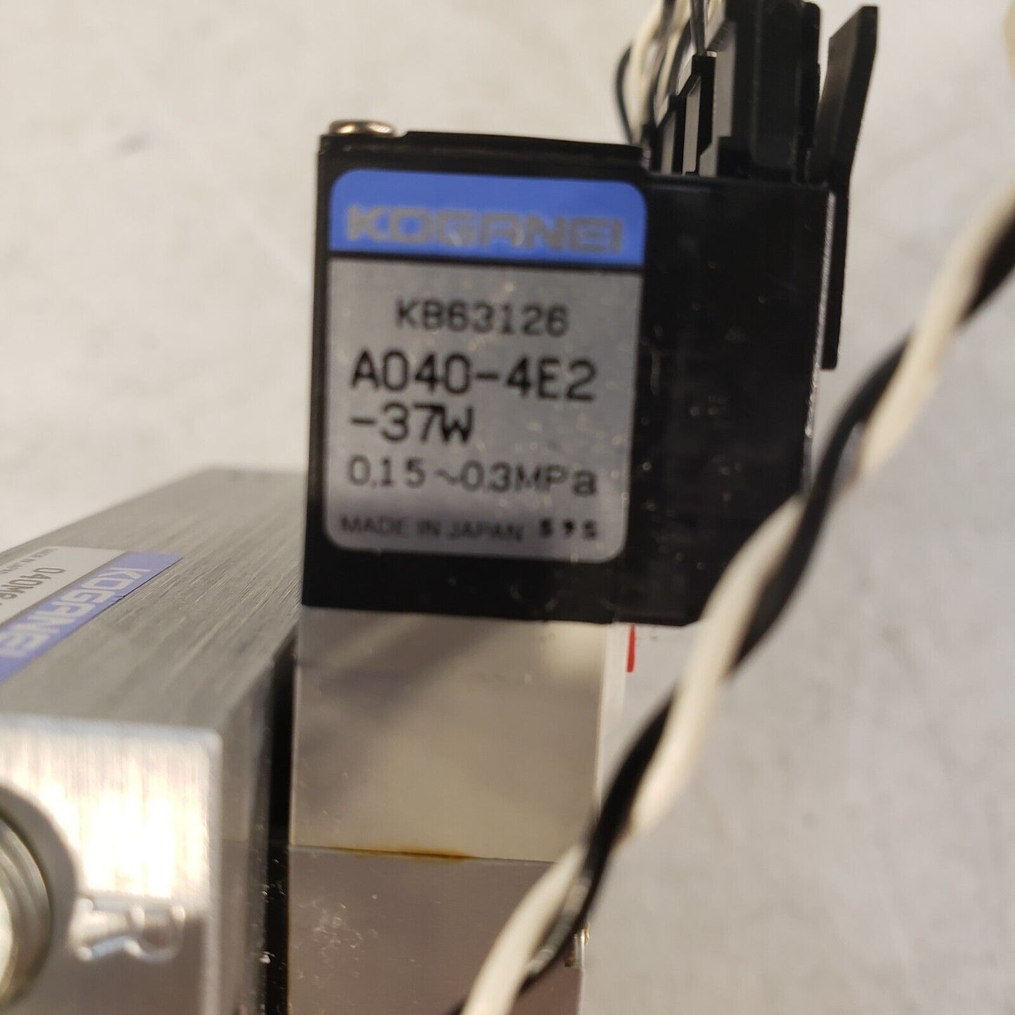 Koganei 040M6A-64W Manifold Block with (7) A040-4E1-37W Solenoid Valves 0.3MPa