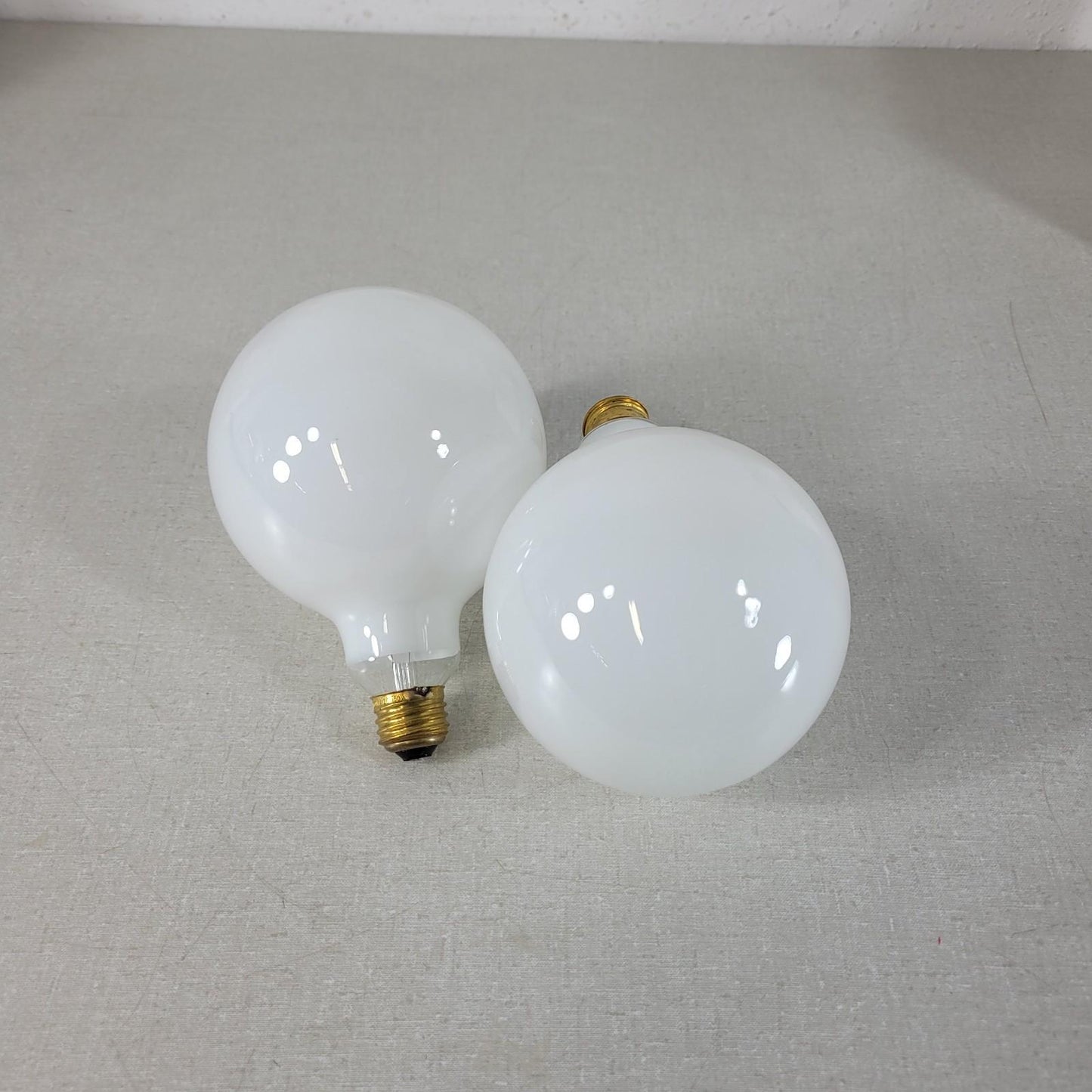 Two UNBRANDED 5" Diameter 120V 150W Round Light Bulbs