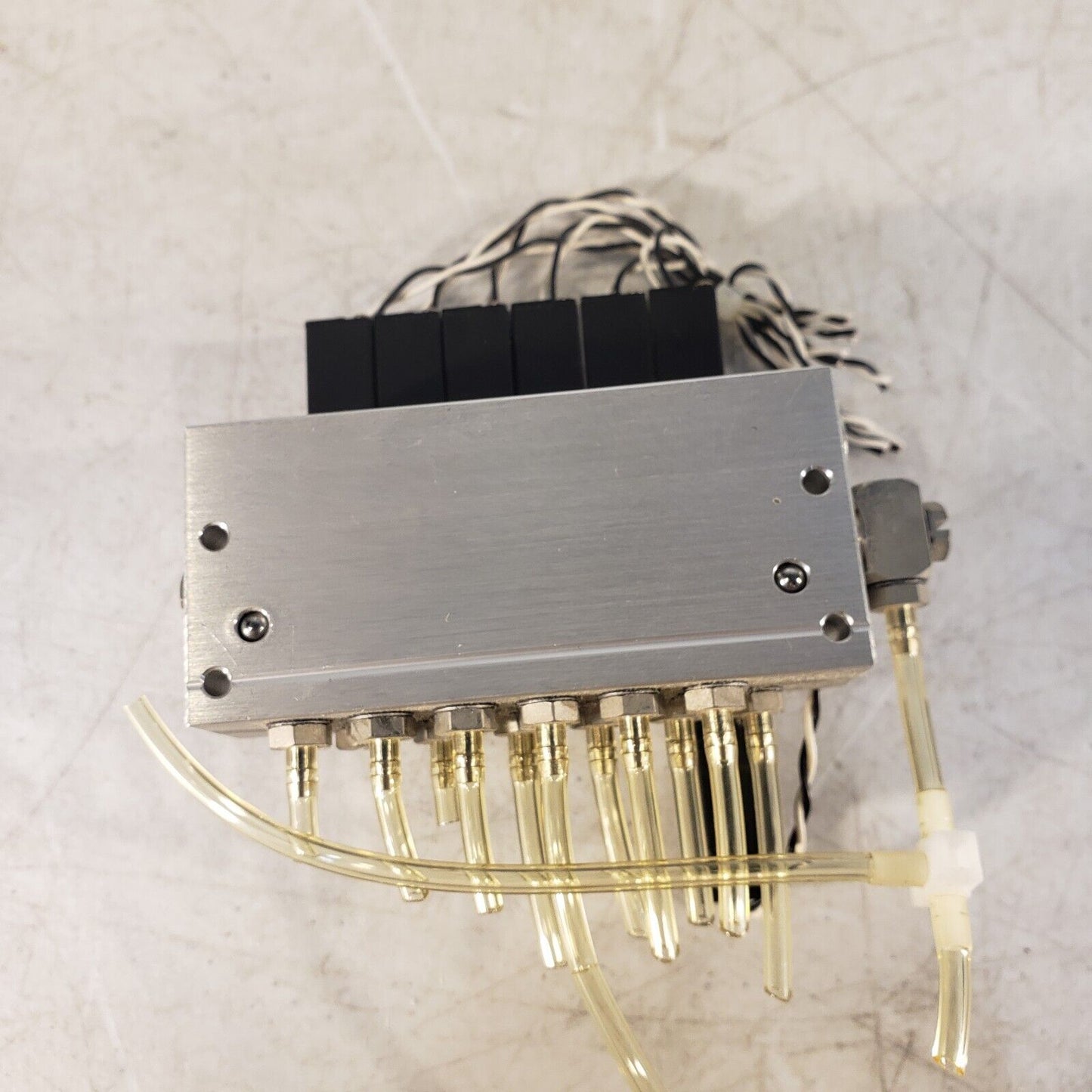 Koganei 040M6A-64W Manifold Block with (7) A040-4E1-37W Solenoid Valves 0.3MPa